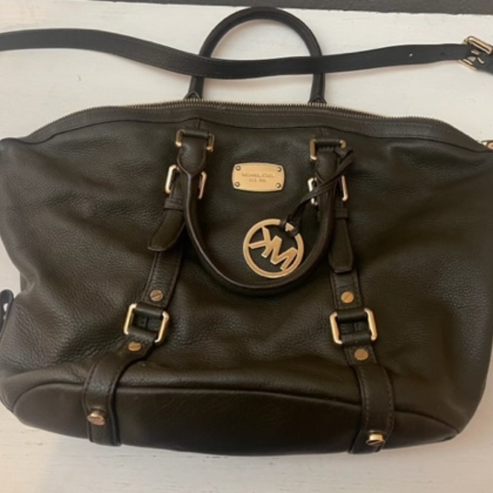 Michael Kors Leather purse with gold hardware.